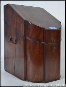 A stunning 19th century Georgian flame mahogany knife box.