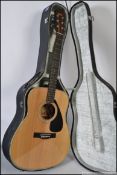A Yamaha acoustic guitar FG-335 II , complete within the original case with song book.