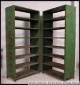 A pair of French mid century Factory / Industrial metal bookcase cabinets in the original green
