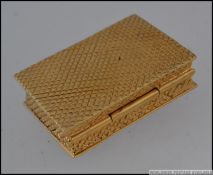 A gold plated on silver pill box with erotic image to the lid L5cm 74g