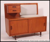 A good 1970's retro teak wood angular Danish influence telephone table having pad seat flaking