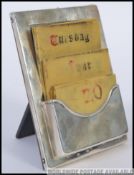 A late 19th / early 20th century silver hallmarked easel desk calendar, bearing a London assay mark,