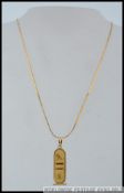 A hallmarked 18ct gold Egyptian cartouche pendant marked with Egyptian standard mark together with