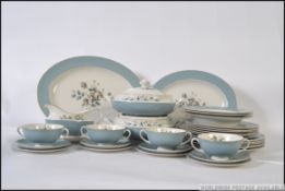 A Royal Doulton part dinner / tea service comprising cups, saucers,
