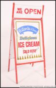 A retro late 20th century point of sale A-board advertising sign for Pollards Ice cream below a
