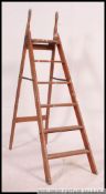 A vintage mid century folding painters wooden ladder having handles to top in good condition