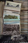 A large collection of approx 1000+ postcards dating from the early 20th century to include many