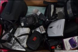 A collection of cameras many still with the boxes to include digital,