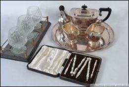 A collection of silver plated items to include part tea service and tray,