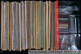 A collection of vinyl long play records consisting of various genres and artists along with a