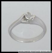 A 9ct gold and diamond ring with single stone being claw mounted approx.25pnts . Total weight 3.