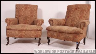 A Victorian Chesterfield Drop Arm Sofa raised on turned supports together with a pair of matching