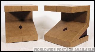 A pair of retro angular bedside tables having unusual vinyl two tone coverings dating from the 20th