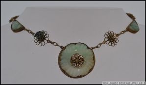 An interesting vintage Chinese gilt filigree decorated necklace with flower decoration and filigree