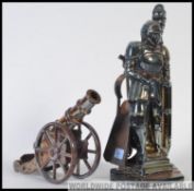 A retro fireside enamel painted companion set together with a matching cannon.