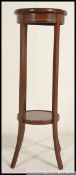 An Edwardian mahogany inlaid torchere / plant stand.