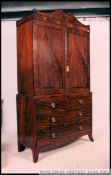 A 19th century Regency mahogany linen press.