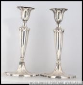 A pair of antique William Hutton & Sons hallmarked silver candlesticks,