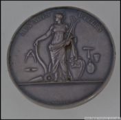 A silver medal coin by Gayrard F.