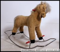 Large retro 1970's Lefray chrome framed rocking horse, having a tubular chrome rocking frame,