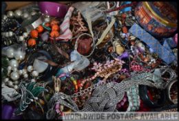 Large box of assorted costume jewellery to include bangles. bracelets, necklaces etc.
