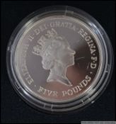 A Queen Elizabeth The Queen Mother 90th Birthday silver crown proof coin complete in the case with