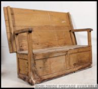 A large Victorian country pine monks bench settle / table.