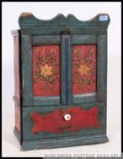A beautifully proportioned hand painted wall cupboard.