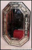 An octagonal 20th century Venetian wall mirror having multiple plates with acid etched details ( 2
