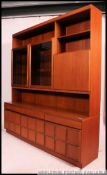 A large 1970's retro McIntosh teak upright wall unit sideboard.