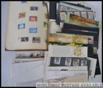 A collection of First Day covers and uncirculated stamps with an approximate value of £40