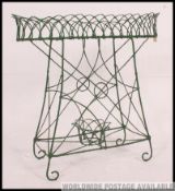 A good retro 1950's green wire work plant stand / florist stand having upper tray ,