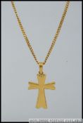 A heavy 18ct gold chain link necklace with large crucifix pendant and hook clasp unmarked.
