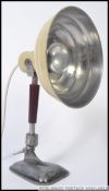 A vintage Pifco heat lamp, later converted into a lamp, standing on a shaped base.