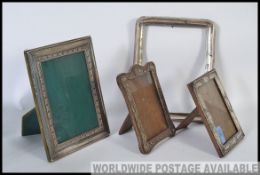 A collection of four silver easel picture frames, hallmarked and stamped 925,