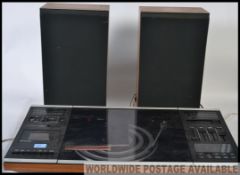 A 1970's Bang & Olufsen Beocentre 2000 hi-fi system together with a matching pair of B&O speakers
