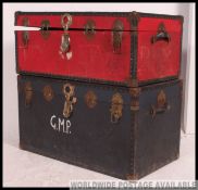 2 20th century steamer trunks / large chests both having hinged tops with clasps.