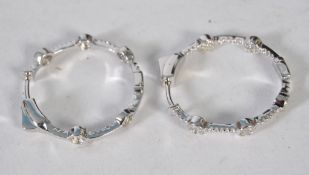 A pair of large silver and cz stone hoop earrings of linked bar design. 11.