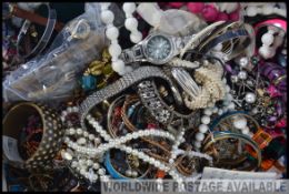 A collection of unsorted costume jewellery to include bracelets, bangles,