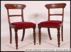 2 Victorian Regency mahogany bar back dining chairs raised on turned legs with red velour drop in