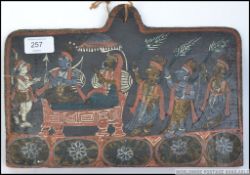 A tribal painting on wood of earthy pigments having tribal figures in a Sudan chair being fanned by