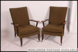 2 vintage Parker Knoll armchairs of Danish influence having angular show wood frames with