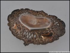 A hallmarked silver small charming pin / soap dish.