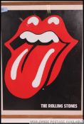 A framed and glazed Rolling Stones poster of the iconic bands lips,