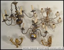 A collection of brass and cut glass chandeliers together with gilt rococo and glass sconce wall