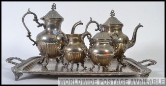 A collection of silver plated wares - to include 2x plated teapots, serving tray,