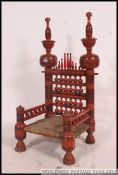 A stunning Indian handpainted red opium / hall chair raised on turned legs with overstuffed velour