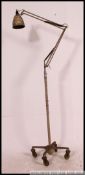 An original early 20th century floorstanding Herbert Terry anglepoise lamp.