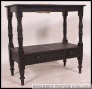 A Victorian ebonised country pine washstand table raised on turned supports with central ceramic