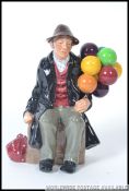 A Royal Doulton figurine HN1954 The Balloon man being stamped to the base with the old green